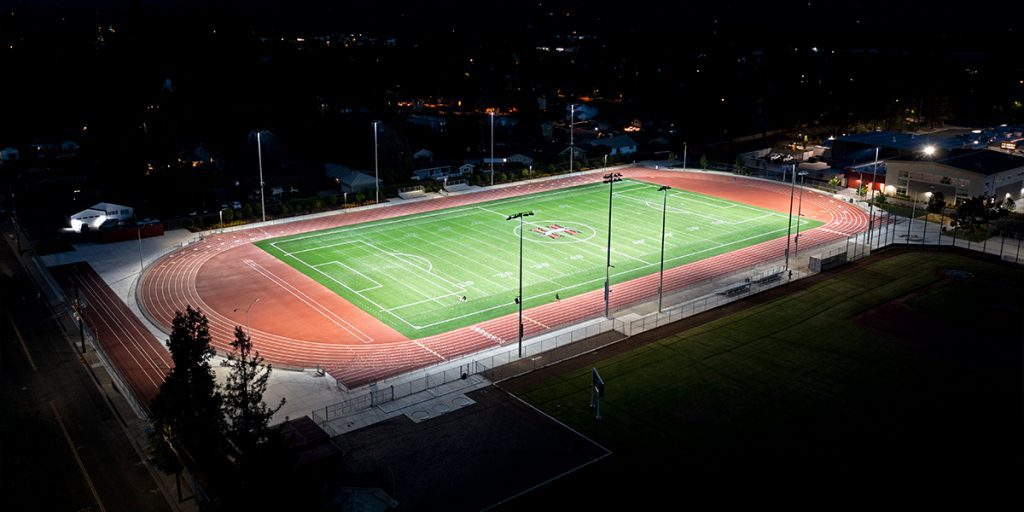 Night photo of Healdsburg High School's soccer field lit with new Musco TLC for LED lighting system.