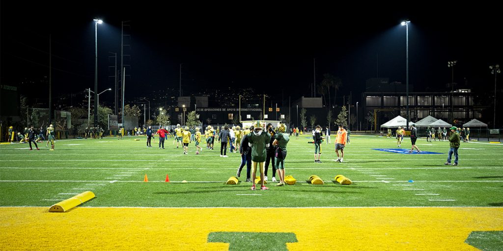 Club Avispones team practices on the competition field after football field retrofit to Musco's TLC for LED lighting system