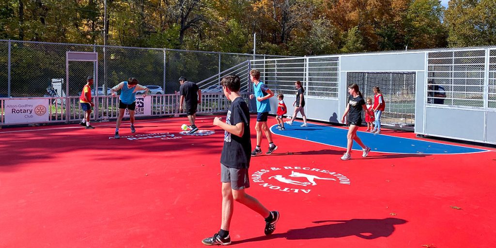 Kids play soccer on new Mini-Pitch System®