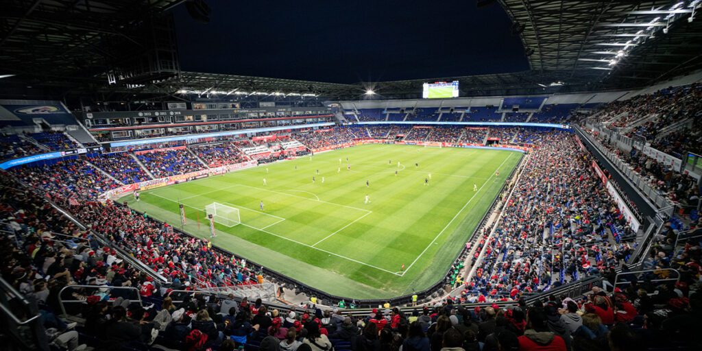 Soccer game at Red Bull Arena being played at night under new LED stadium lights.