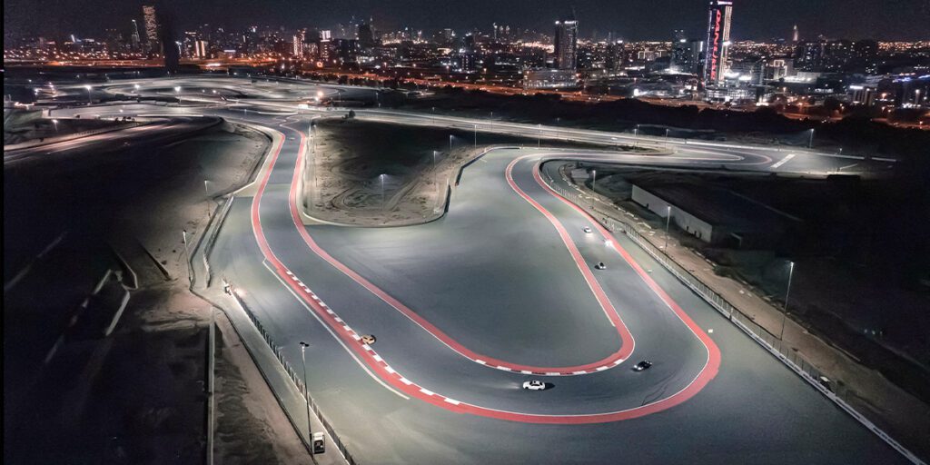 Night race at Dubai Autodrome. Racetrack lit Musco LED lighting