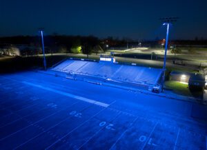 Passaic County Technical Institute Football Stadium lit in blue.