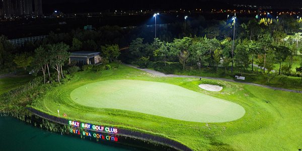 Green at Salt Bay Golf Club lit at night after LED lighting upgrade.