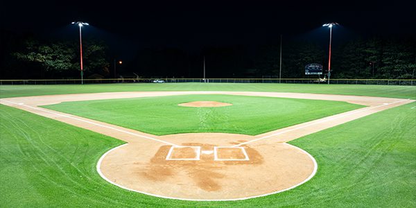 Lakeman Field diamond lit at night with LED baseball field lighting.
