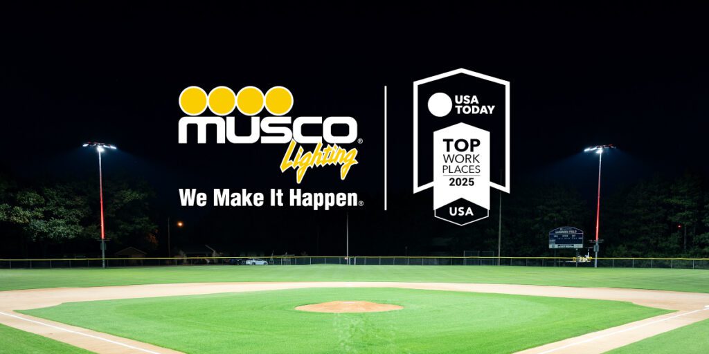 Baseball field with the Musco Lighting and 2025 USA Today Top Workplace logo flanked by two Musco light systems.